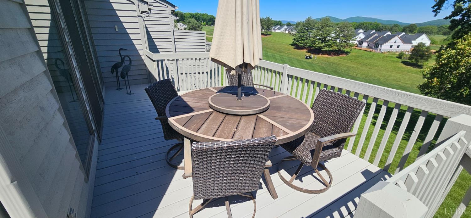 204 Shaker Lane Forest, VA 24551 - Photo 10 of 41 a view of a balcony with table and chairs