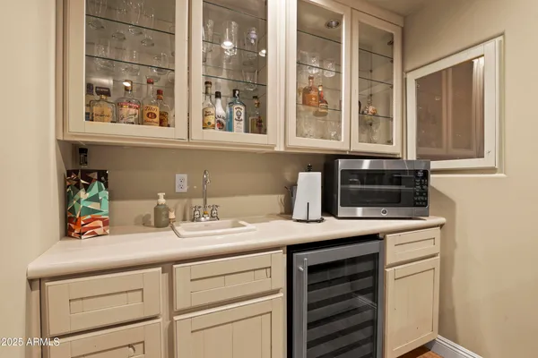 a kitchen with a sink and cabinets