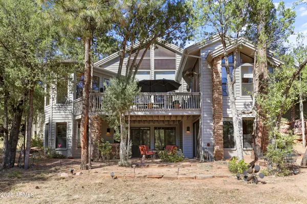 a front view of a building with umbrellas