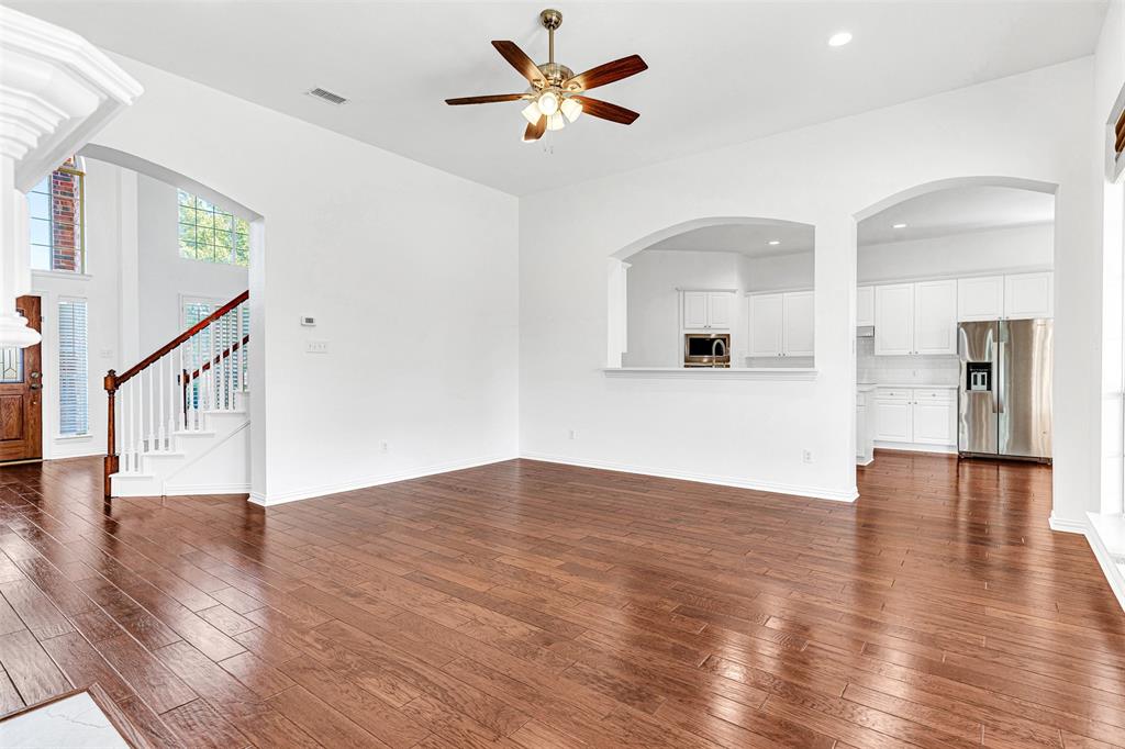 4332 Risinghill Drive Plano, TX 75024 - Photo 19 of 29 The family room has plenty of space for any size and style of furniture, and still gives easy access through arched doorways to the kitchen and foyer. There's even a convenient pass-through and breakfast bar to the kitchen.