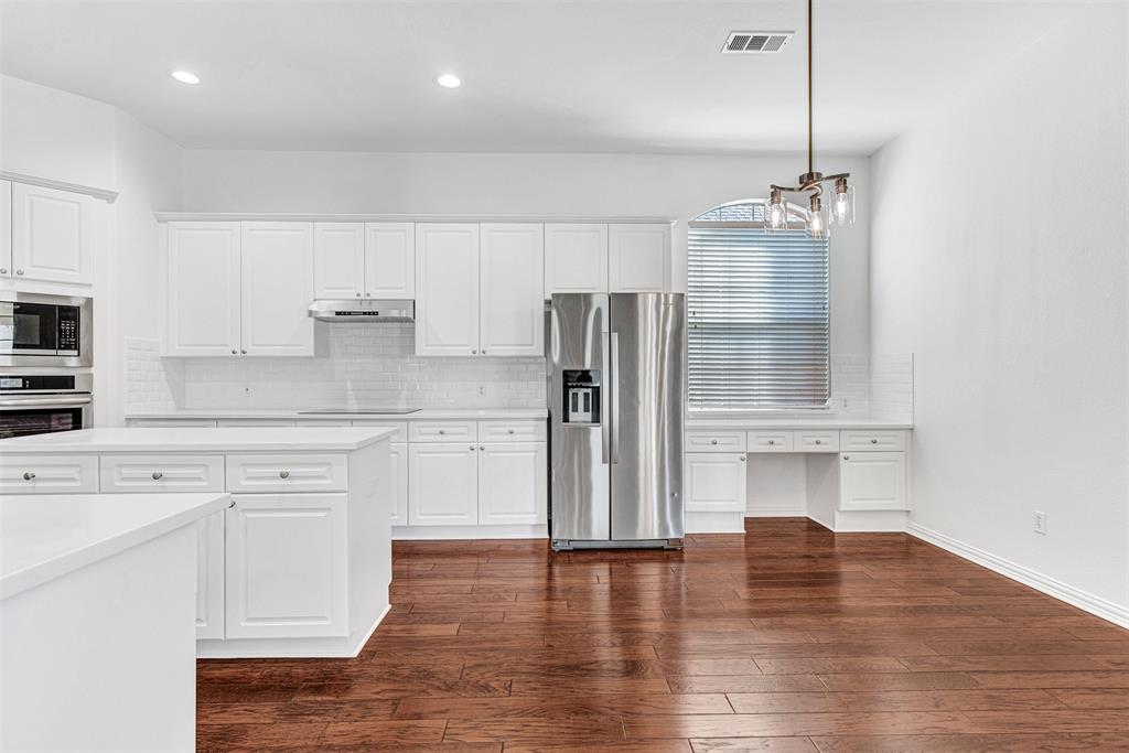 4332 Risinghill Drive Plano, TX 75024 - Photo 2 of 29 This is your dream kitchen! Quartz counters (2025), fresh paint, LVP floors throughout, planning desk and so much more!