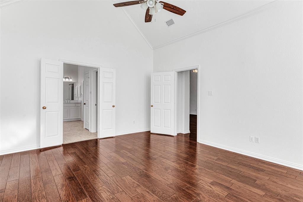 4332 Risinghill Drive Plano, TX 75024 - Photo 22 of 29 Double doors to the primary bath keep it private and quiet! The vaulted ceiling gives the room a very spacious and airy feel.