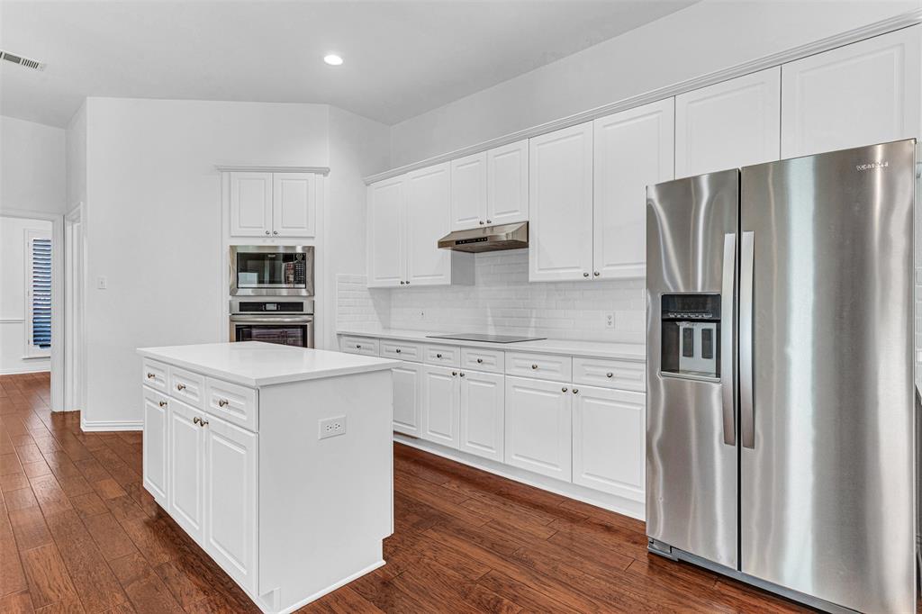 4332 Risinghill Drive Plano, TX 75024 - Photo 3 of 29 So much counter and cabinet space - ready for all your stuff! The center island is great for preparing meals and serving, with matching quartz top.