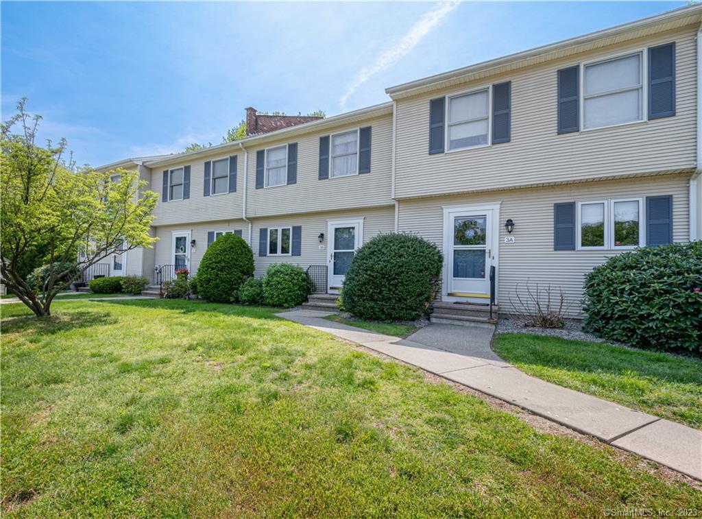 288 Broad Brook Road, Unit 3B Enfield, CT 06082 - Photo 1 of 1 a view of a house with backyard and plants