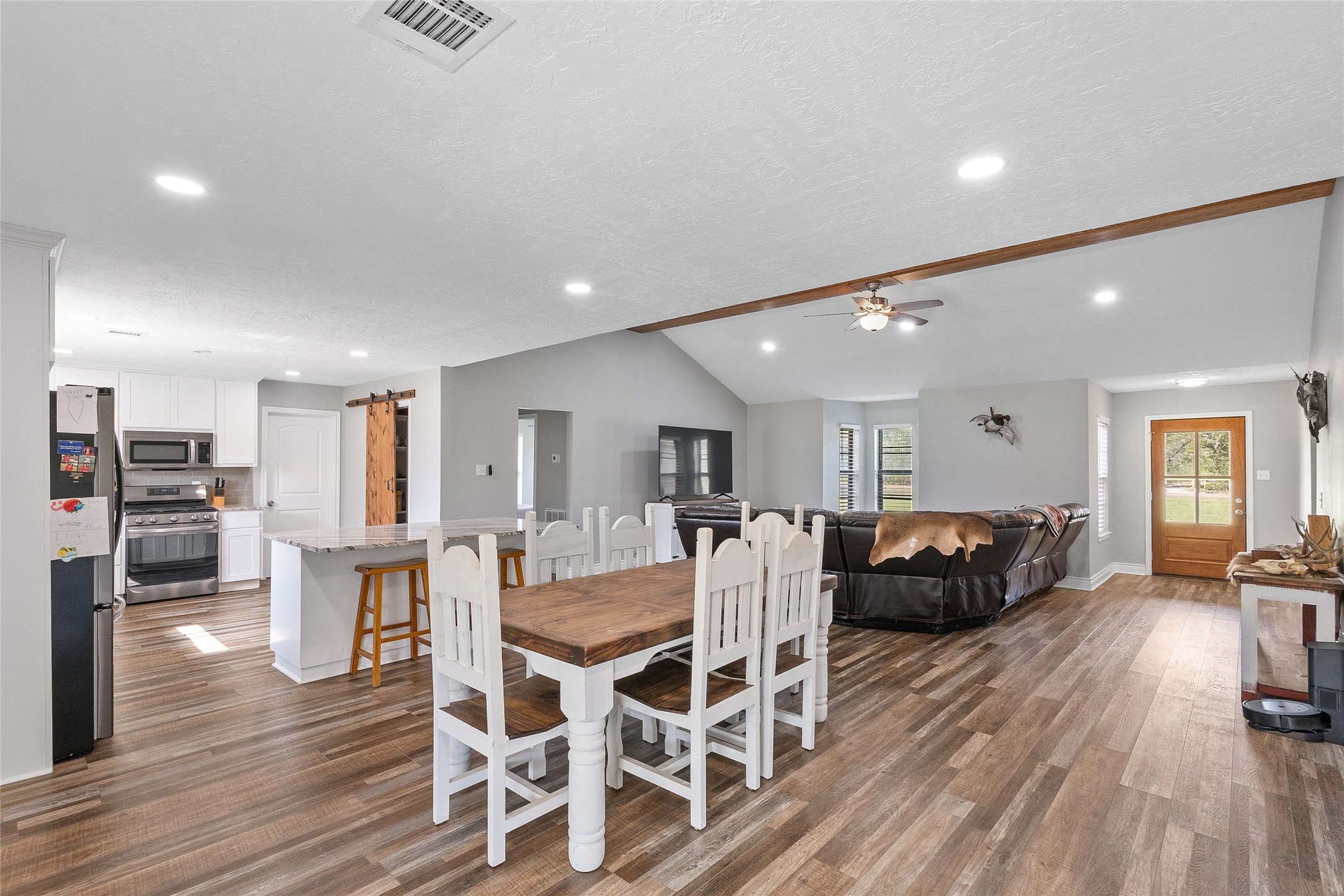 11050 Antioch Road Midway, TX 75852 - Photo 13 of 34 a view of a dining room with furniture wooden floor and chandelier