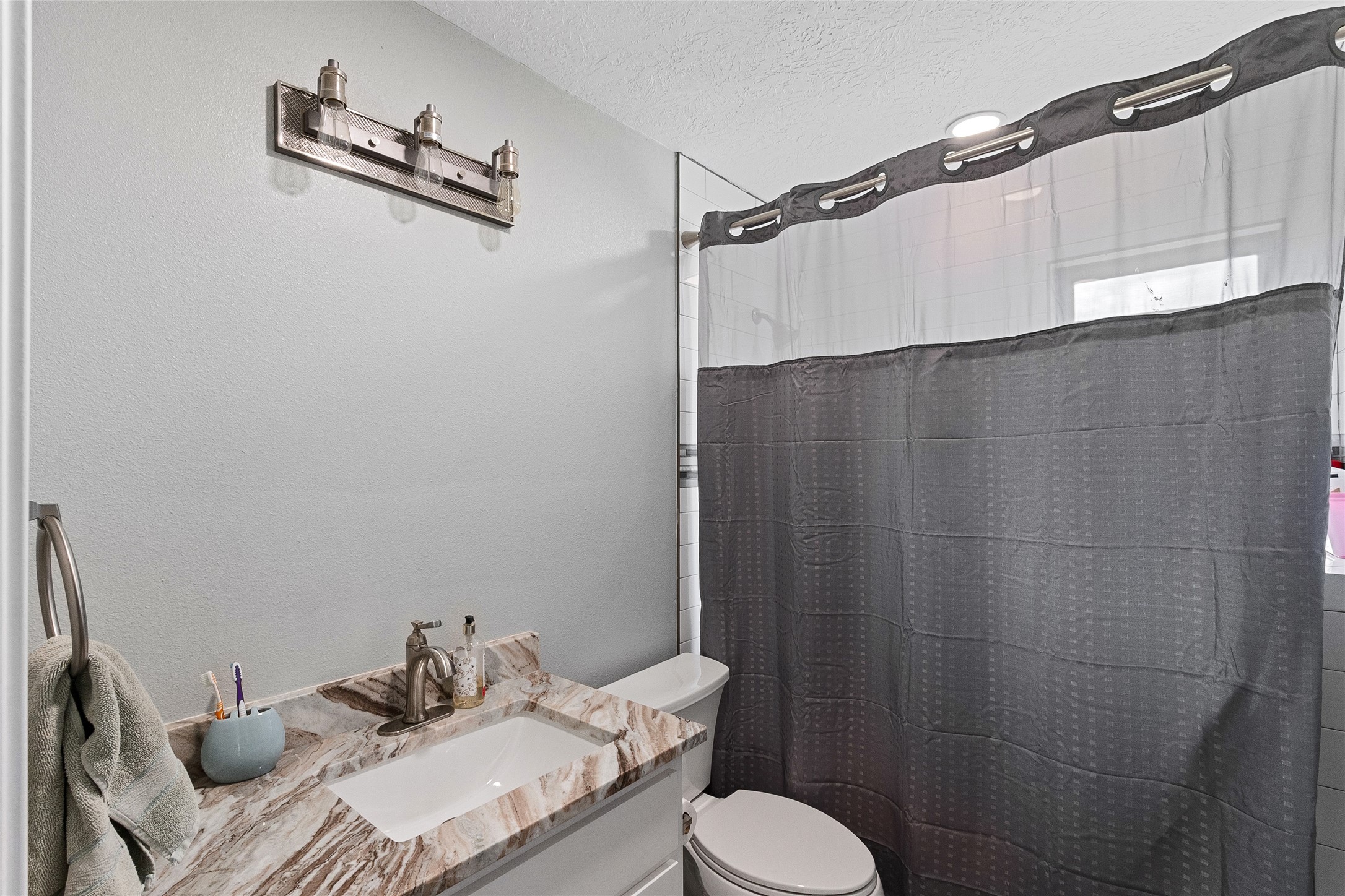 11050 Antioch Road Midway, TX 75852 - Photo 31 of 34 a bathroom with a sink and a toilet