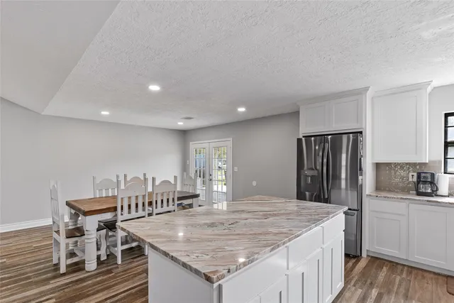 a kitchen with a table and chairs in it