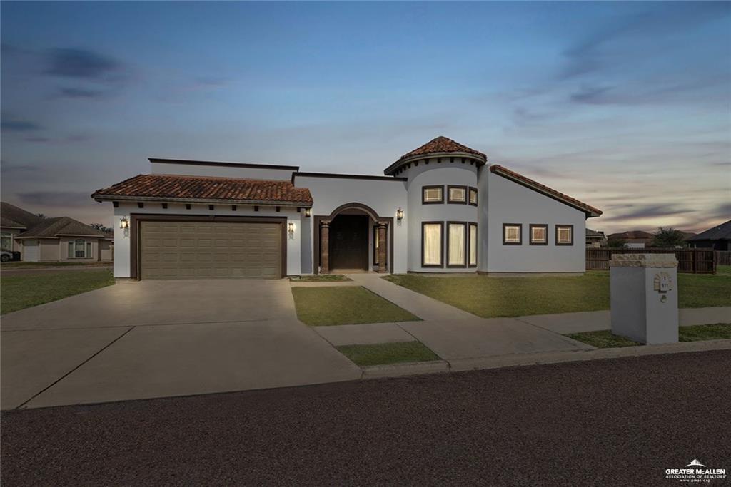 511 Mi Vida Street Weslaco, TX 78596 - Photo 1 of 13 a view of a big house with a street