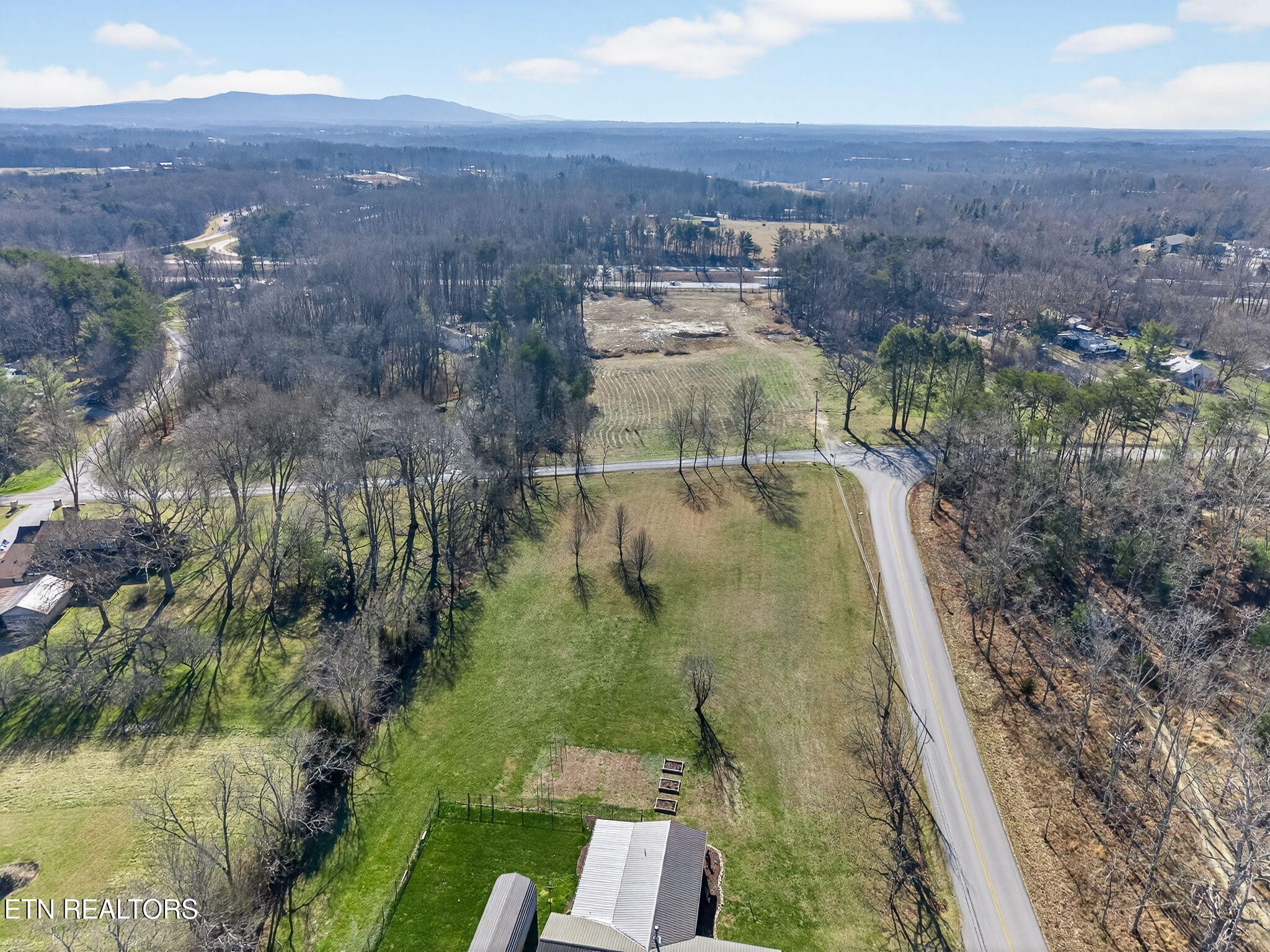 1 Chestnut Hill Road Crossville, TN 38571 - Photo 7 of 11 an aerial view of residential houses with outdoor space and trees
