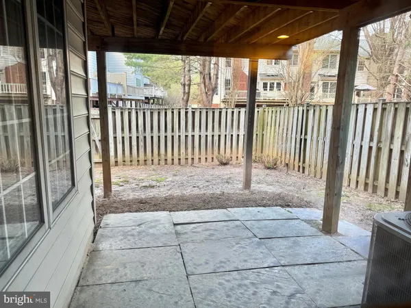 a view of a house with wooden deck