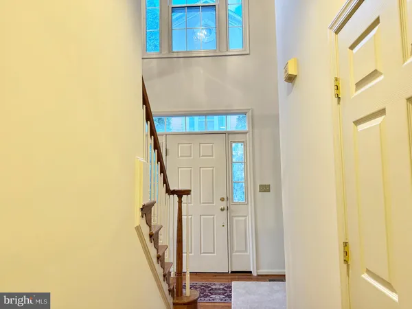 a view of a room with wooden floor and fireplace