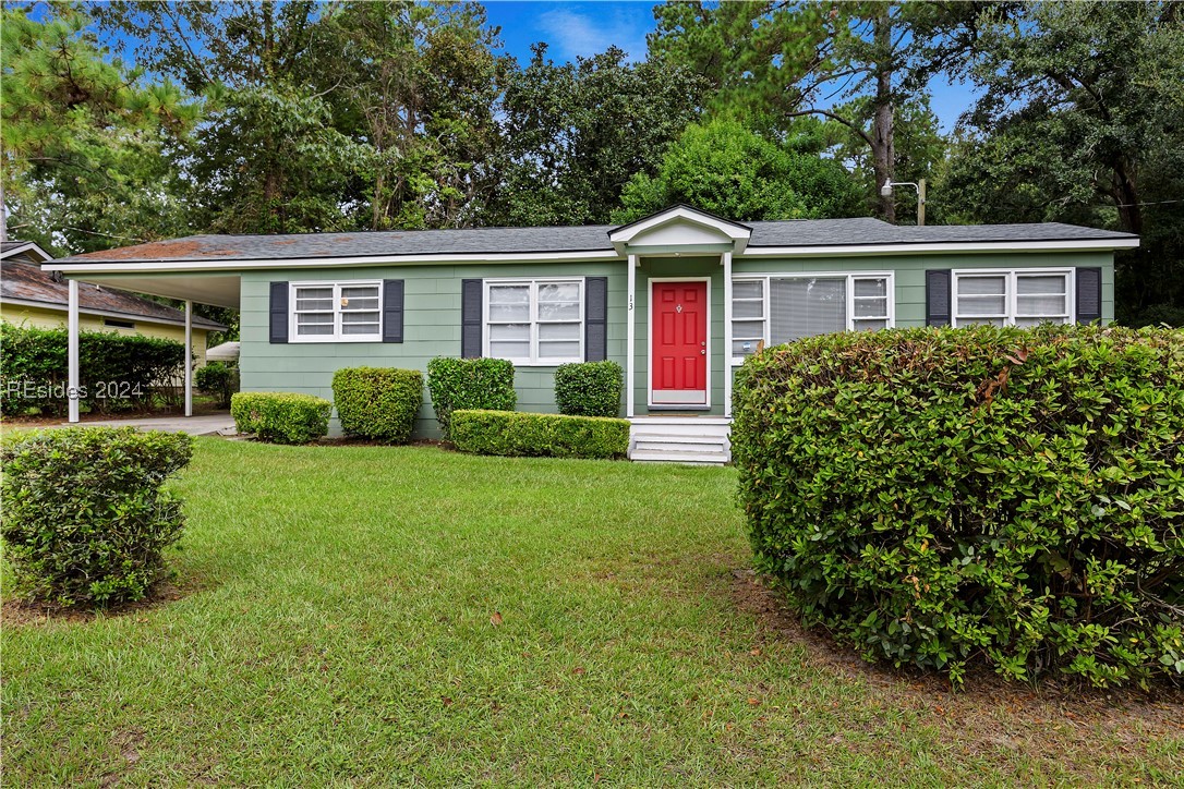 13 Charles Street Hardeeville, SC 29927 - Photo 1 of 1 Single story home with a front yard and a carport
