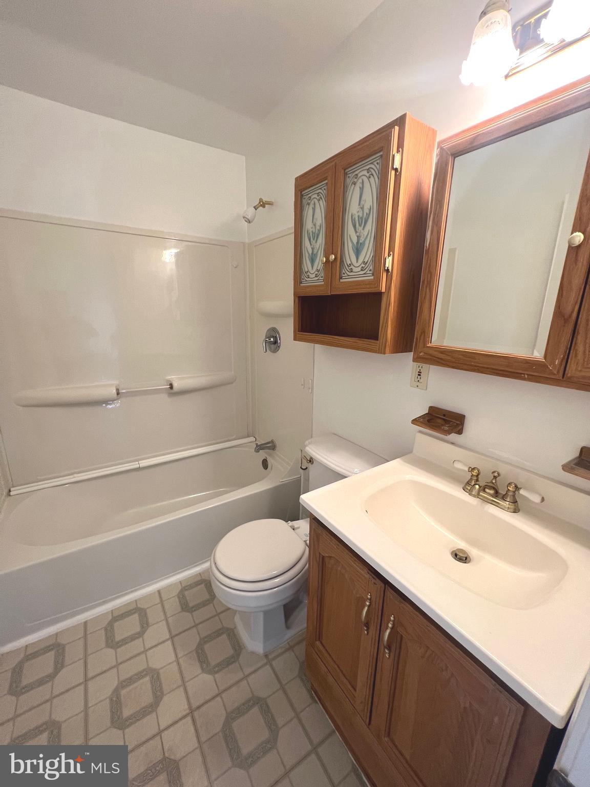 4457 Fenor Road Halethorpe, MD 21227 - Photo 26 of 29 a bathroom with a sink toilet and shower