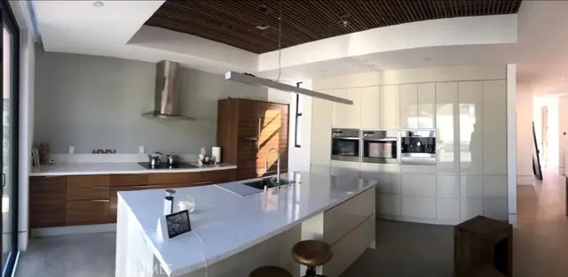 a kitchen with refrigerator and cabinets