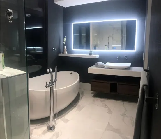 a bathroom with a bathtub and a sink