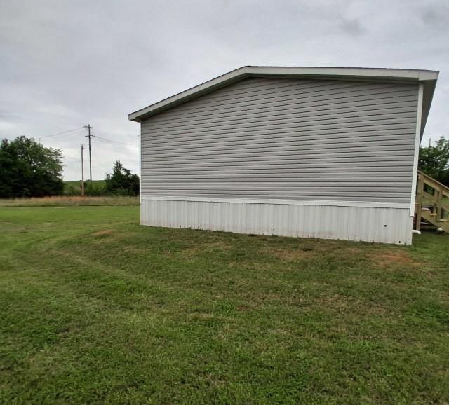 798 North 4190 Road Hugo, OK 74743 - Photo 16 of 16 a side view of a house having yard
