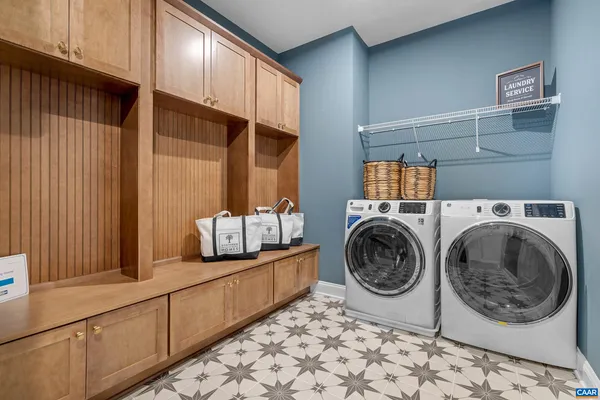 a view of a storage & utility room with sink washer and dryer