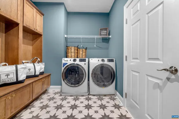 a kitchen with stainless steel appliances granite countertop a sink a stove and cabinets