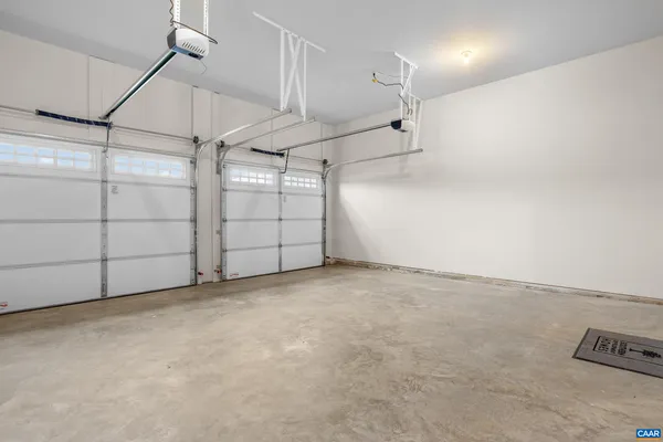 a large kitchen with a table and chairs