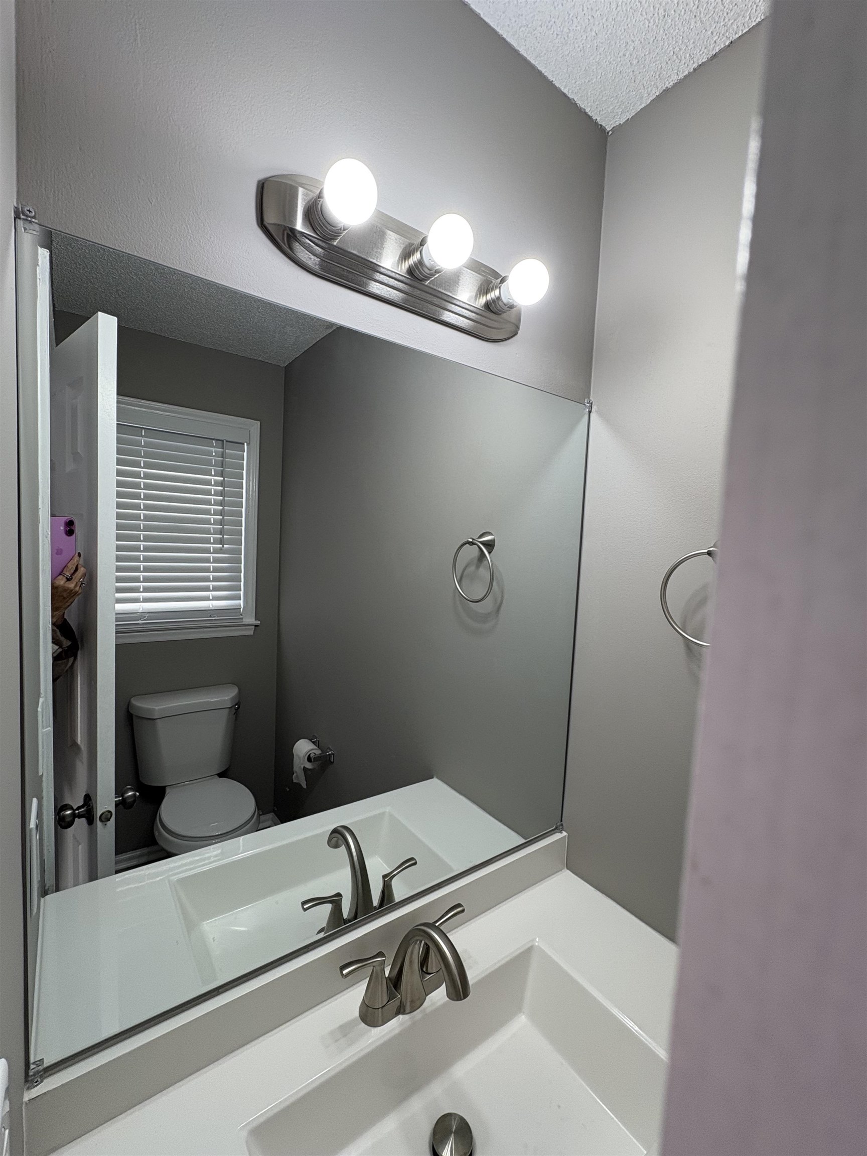 4641 Socastee Boulevard, Unit D1 Myrtle Beach, SC 29588 - Photo 10 of 12 Bathroom with a textured ceiling and vanity