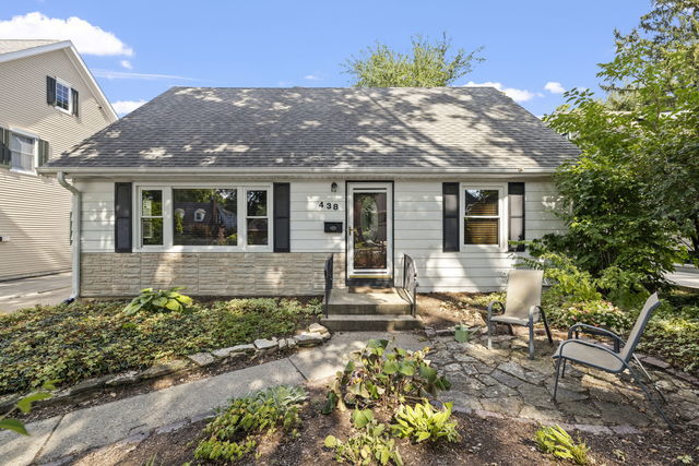 438 South Wright Street Naperville, IL 60540 - Photo 2 of 26 a front view of a house with a garden