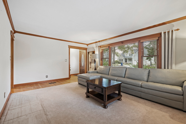 438 South Wright Street Naperville, IL 60540 - Photo 3 of 26 a living room with furniture and a large window