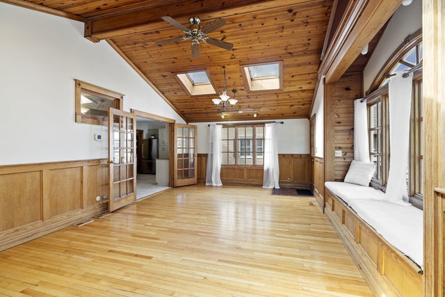 438 South Wright Street Naperville, IL 60540 - Photo 7 of 26 a view of a hall with wooden floor and windows