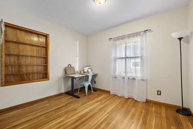 438 South Wright Street Naperville, IL 60540 - Photo 9 of 26 a view of a workspace with wooden floor and a window