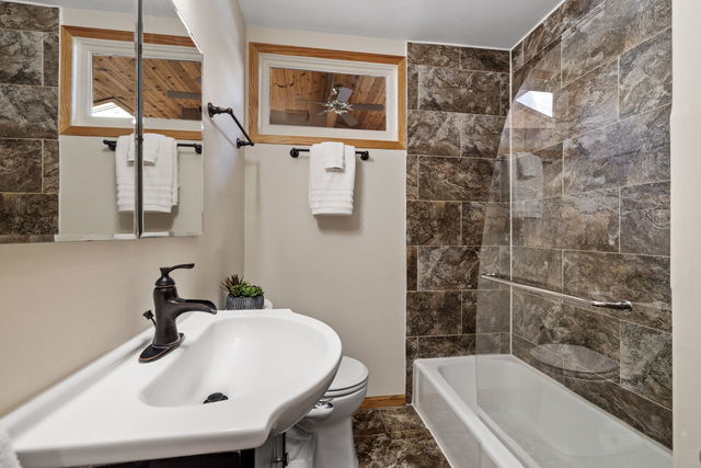 438 South Wright Street Naperville, IL 60540 - Photo 10 of 26 a bathroom with a sink and a bathtub