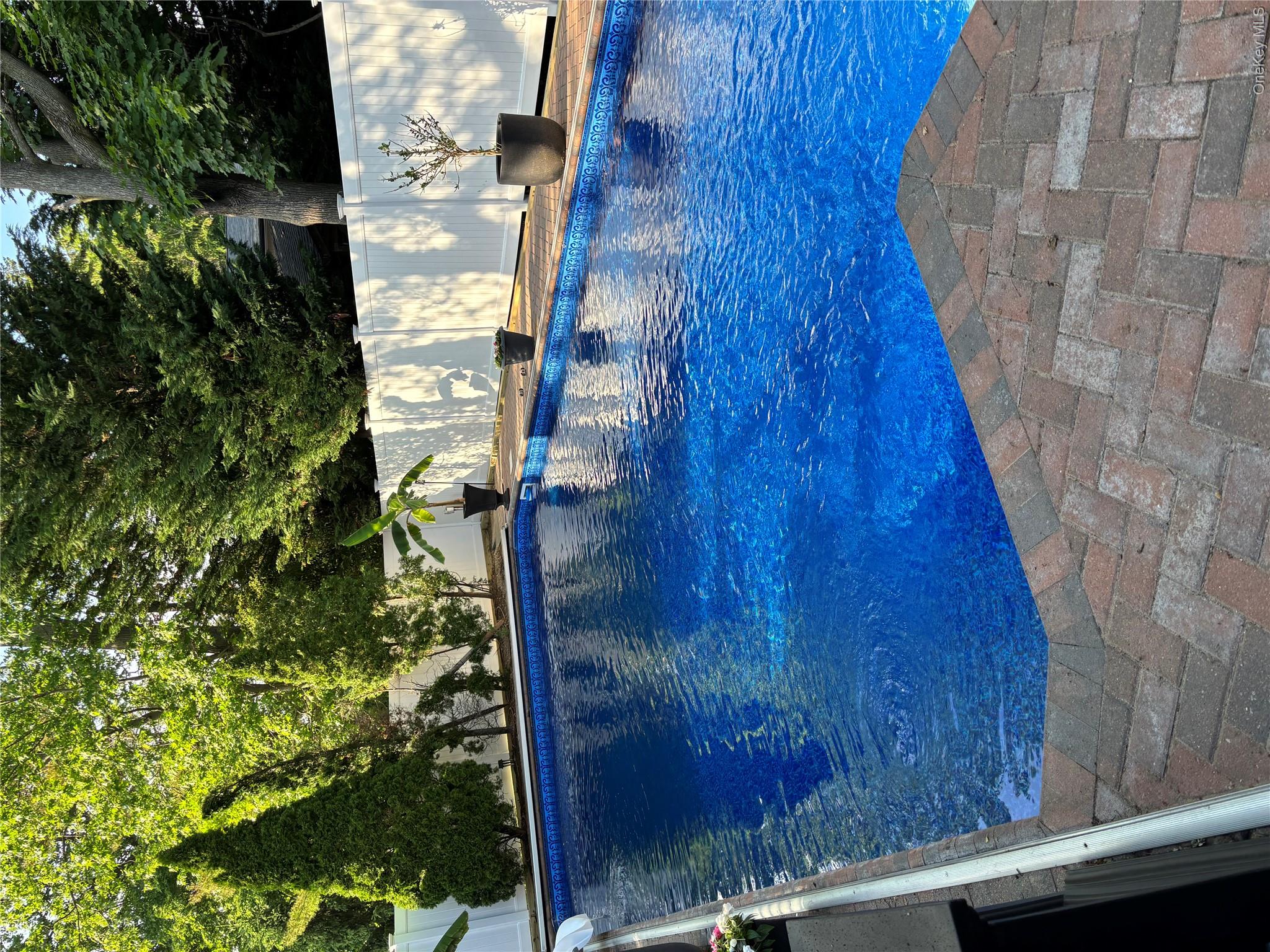 2043 Ripley Lane Merrick, NY 11566 - Photo 7 of 42 a view of swimming pool with seating space