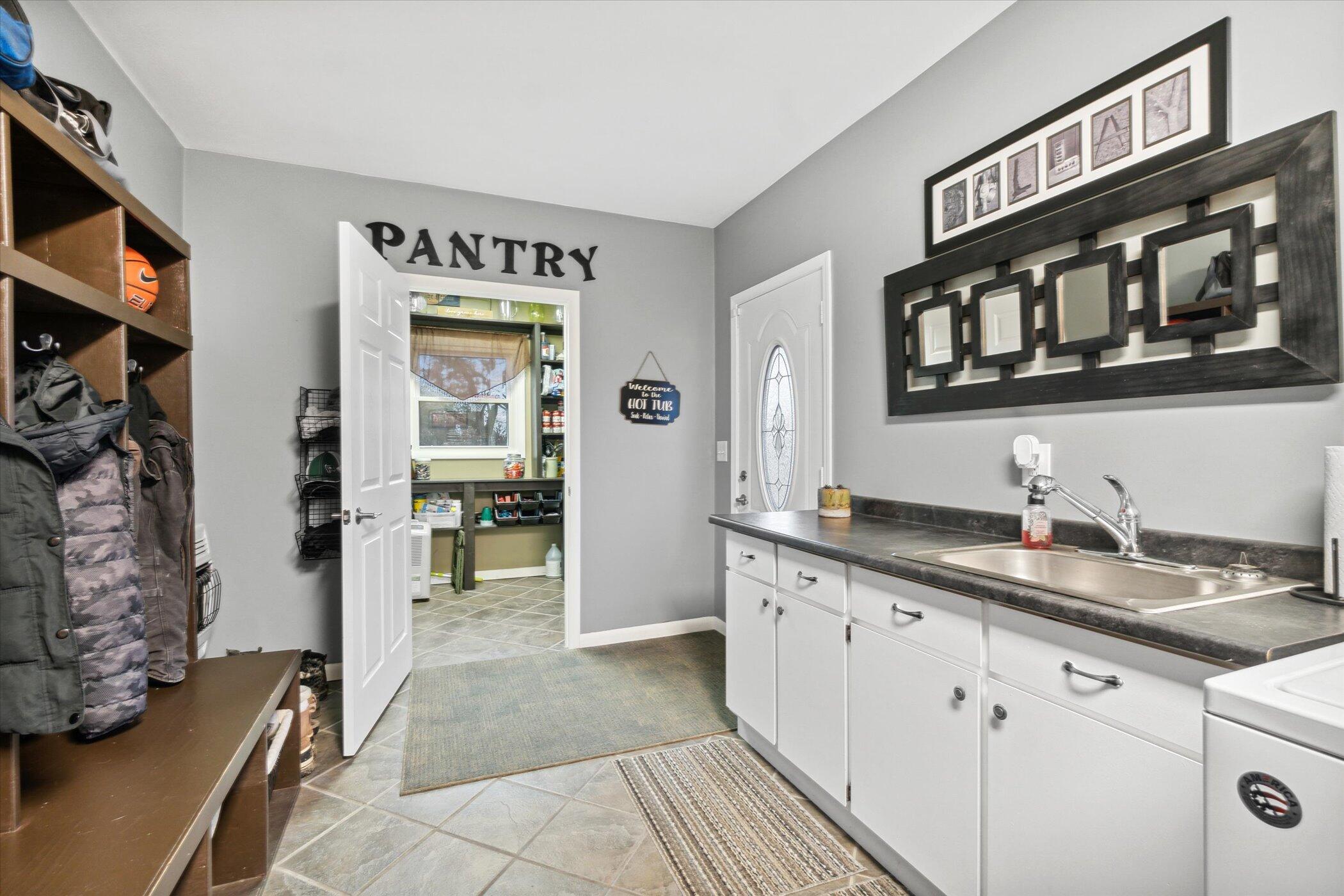 9990 Culver Road Clarklake, MI 49234 - Photo 14 of 42 14-Laundry_mudroom to pantry