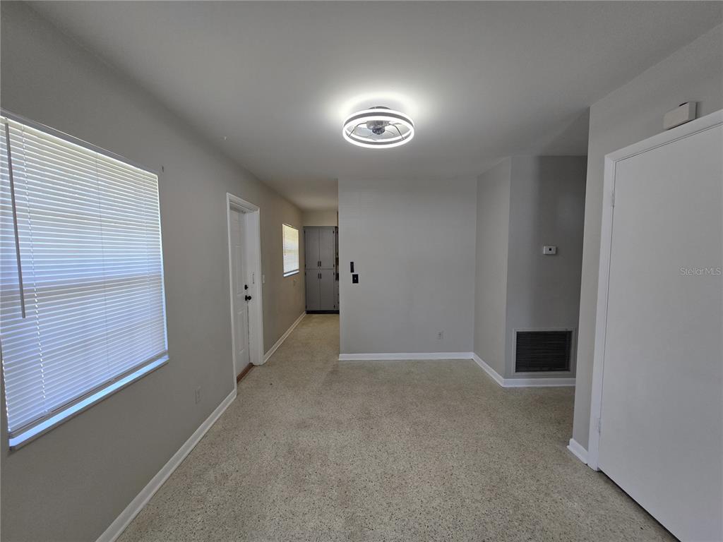 215 Clemons Road Brandon, FL 33510 - Photo 3 of 8 a view of an empty room with a window