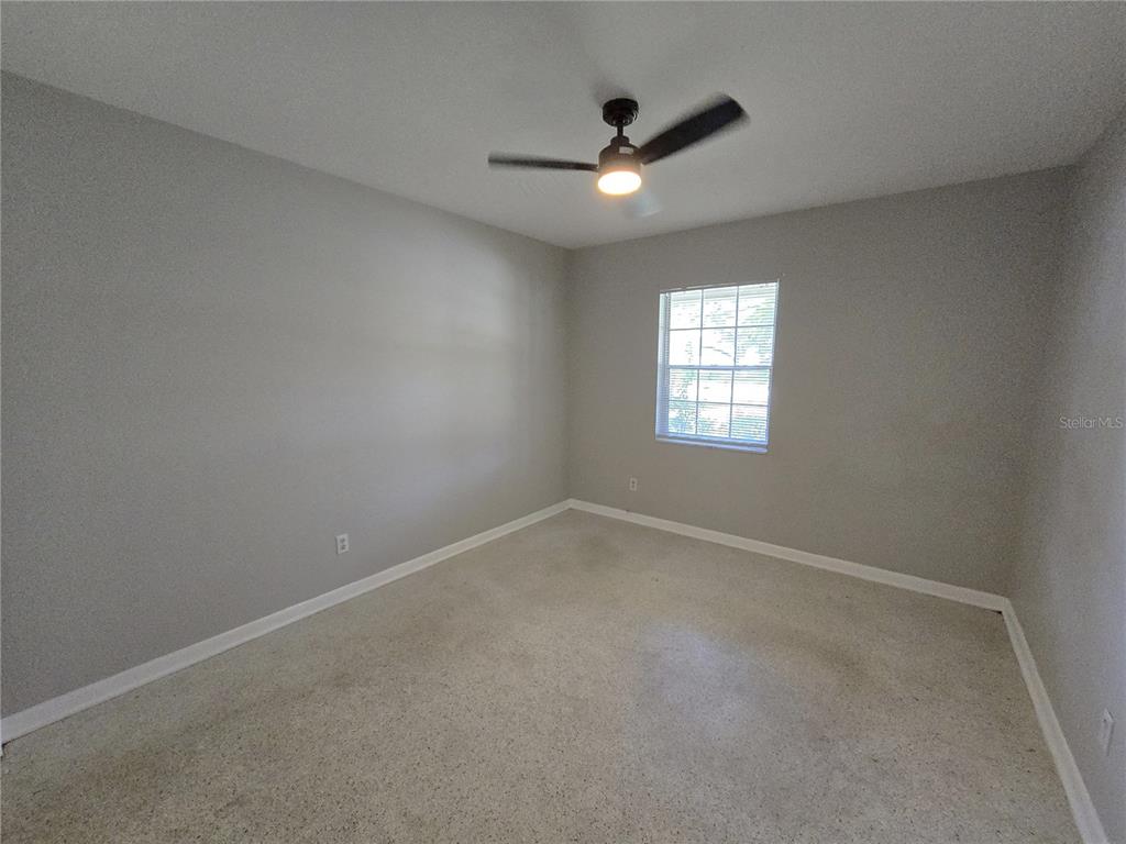 215 Clemons Road Brandon, FL 33510 - Photo 8 of 8 an empty room that has window