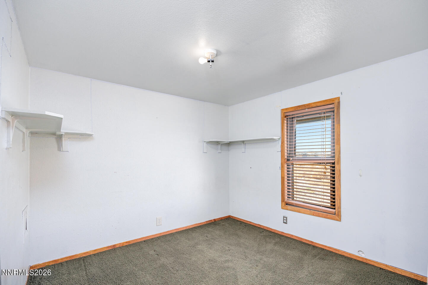 5465 Caleb Drive Fallon, NV 89406 - Photo 11 of 23 a view of an empty room with a window