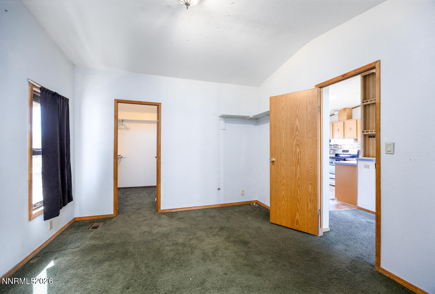 5465 Caleb Drive Fallon, NV 89406 - Photo 15 of 23 an empty room with closet and a hallway