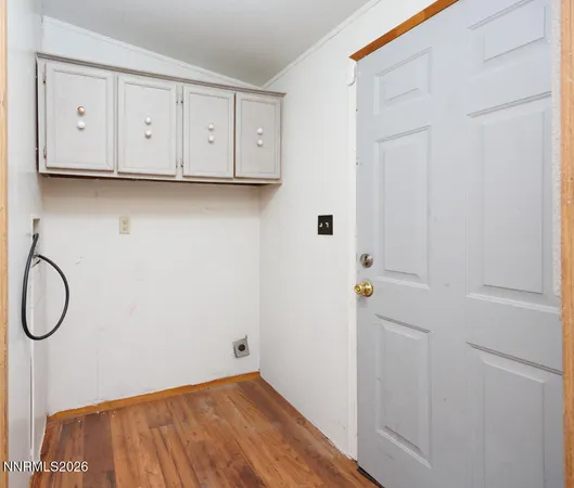 a view of a storage and utility room with racks on the wall