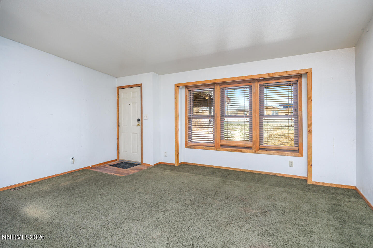 5465 Caleb Drive Fallon, NV 89406 - Photo 6 of 23 a view of an empty room with a window