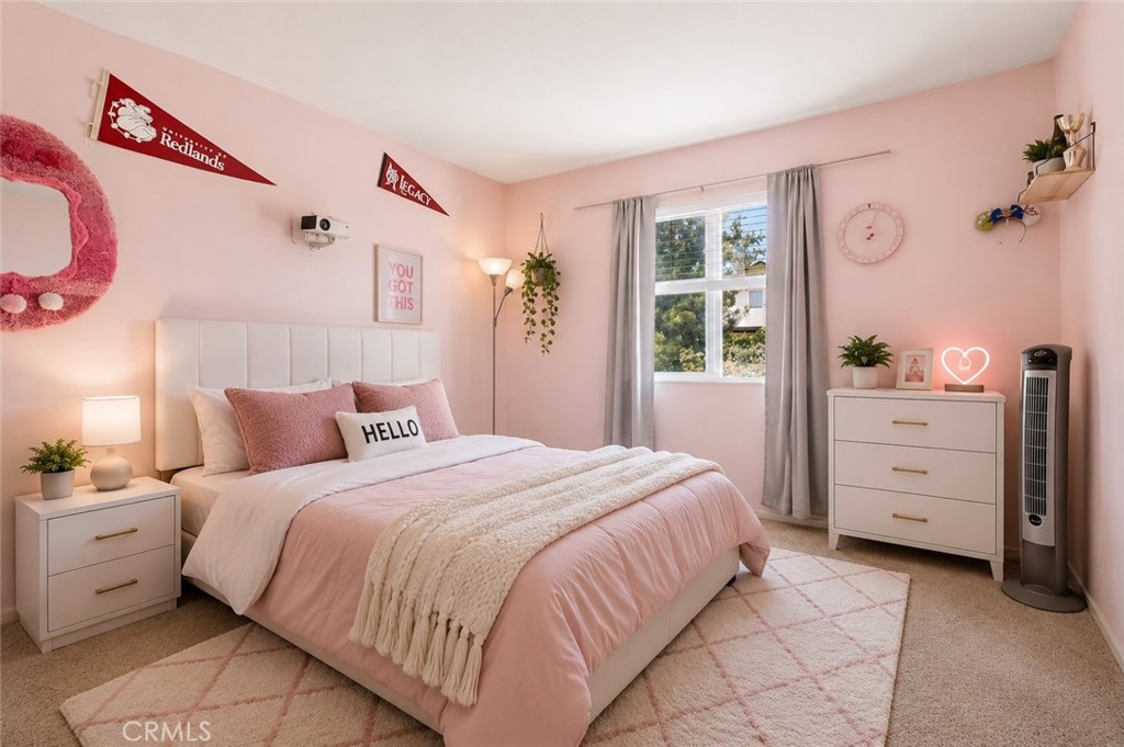 152 Alabaster Loop Perris, CA 92570 - Photo 23 of 29 a bedroom with a bed and a window