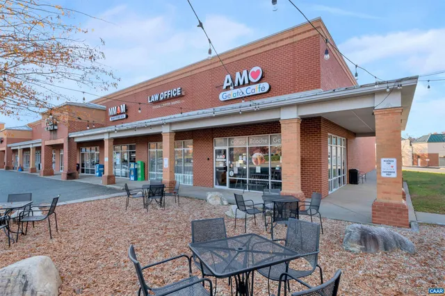 a view of a park with potted plants