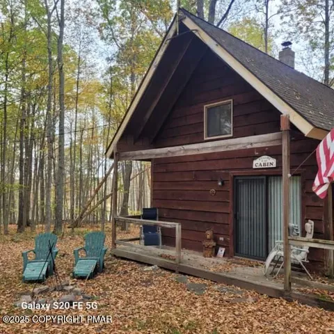 a backyard of the house with outdoor seating