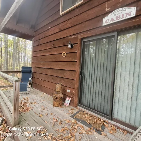 a view of a door and chair in the room