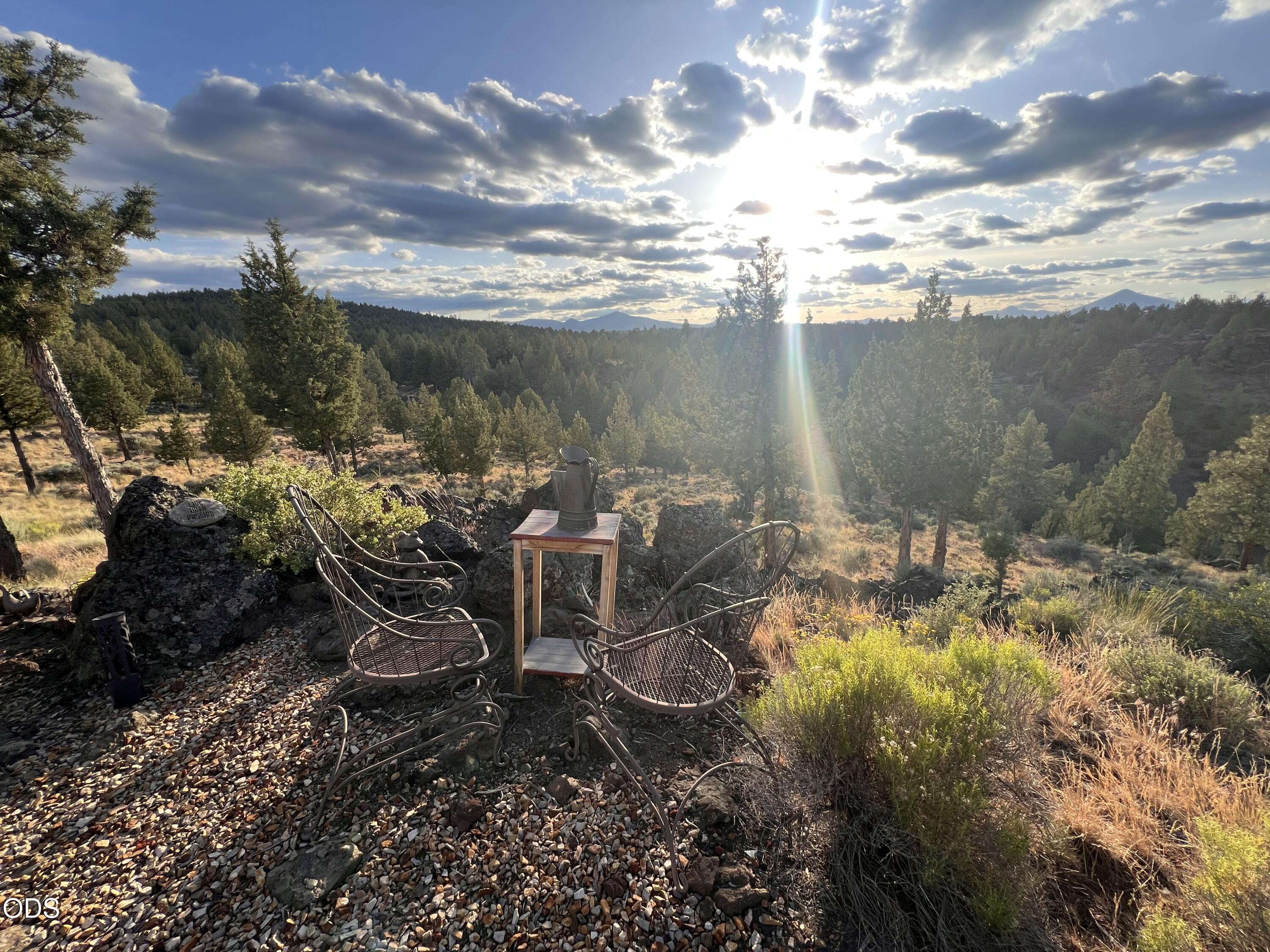 17771 A J Warrin Road Sisters, OR 97759 - Photo 127 of 135 a view of a lake with lawn chairs