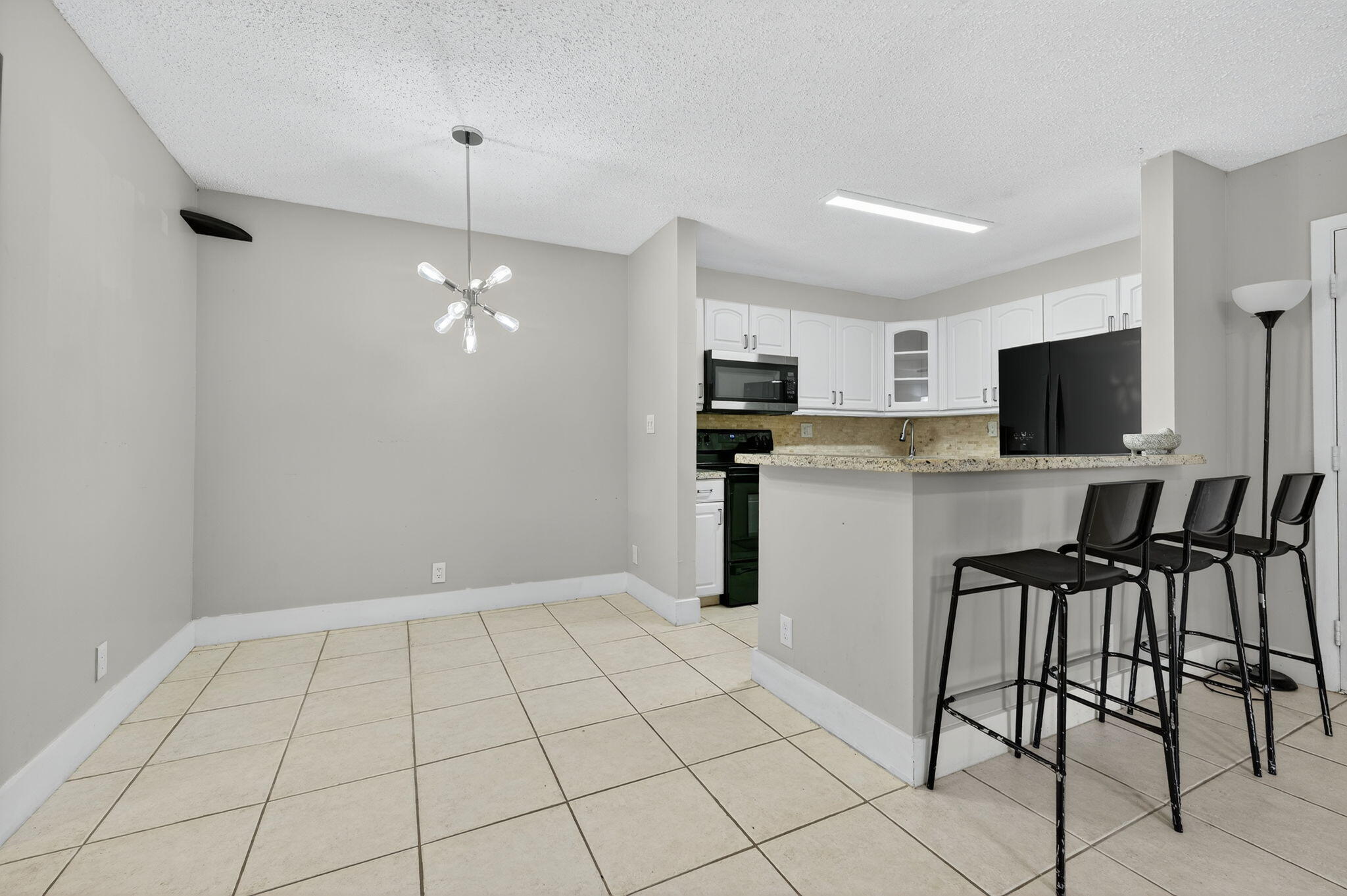 9441 West McNab Road, Unit 111 Tamarac, FL 33321 - Photo 8 of 27 Dining Area and Kitchen
