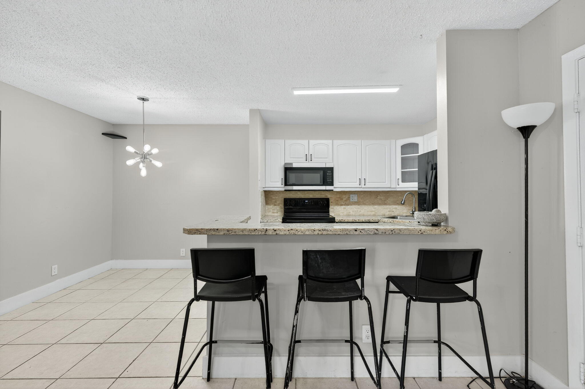 9441 West McNab Road, Unit 111 Tamarac, FL 33321 - Photo 9 of 27 Dining Area and Kitchen