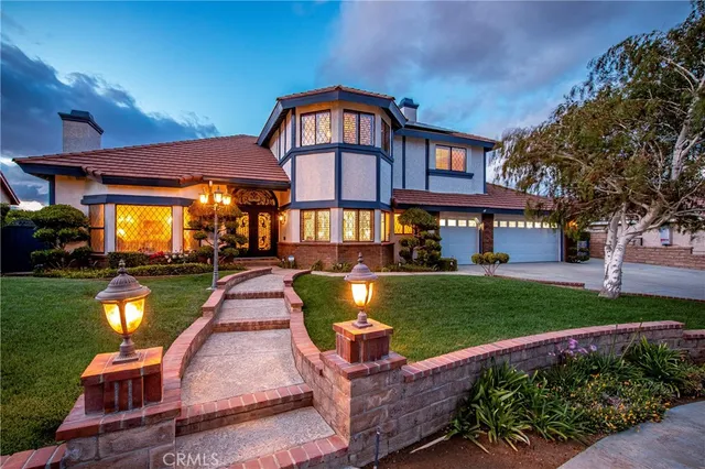 a front view of a house with a yard table and chairs
