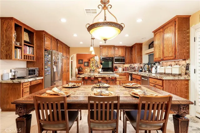 a bathroom with a granite countertop sink mirror and shower