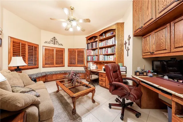 a spacious bedroom with a bed and a chandelier