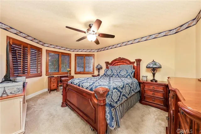 a view of a balcony with furniture and a floor to ceiling window