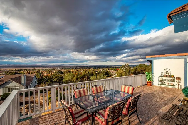 a kitchen with stainless steel appliances granite countertop a refrigerator stove and cabinets