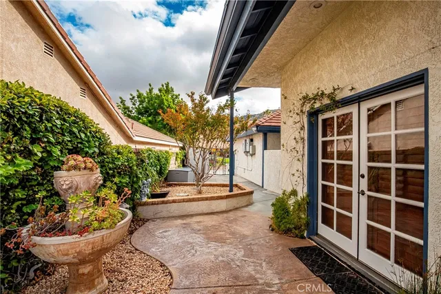 a view of a swimming pool and lounge chairs
